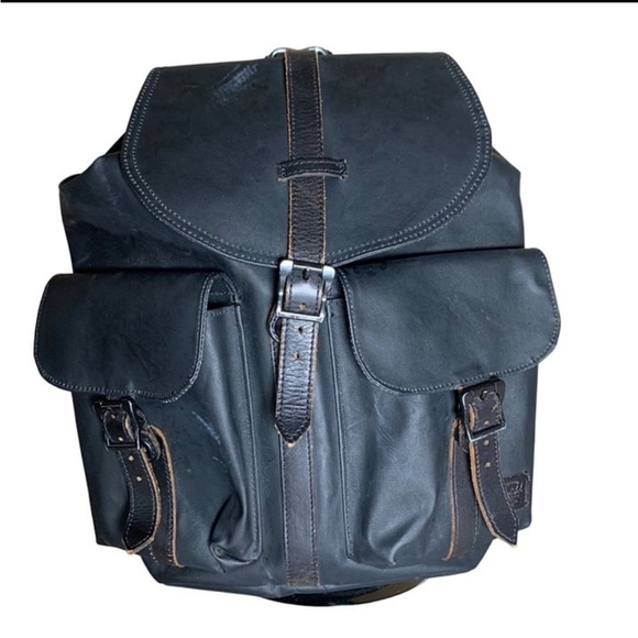 Chic Herschel backpack rugged look black and leather.